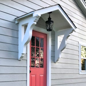 Want to know how to add curb appeal to a flat front house? Build a small portico above your door!